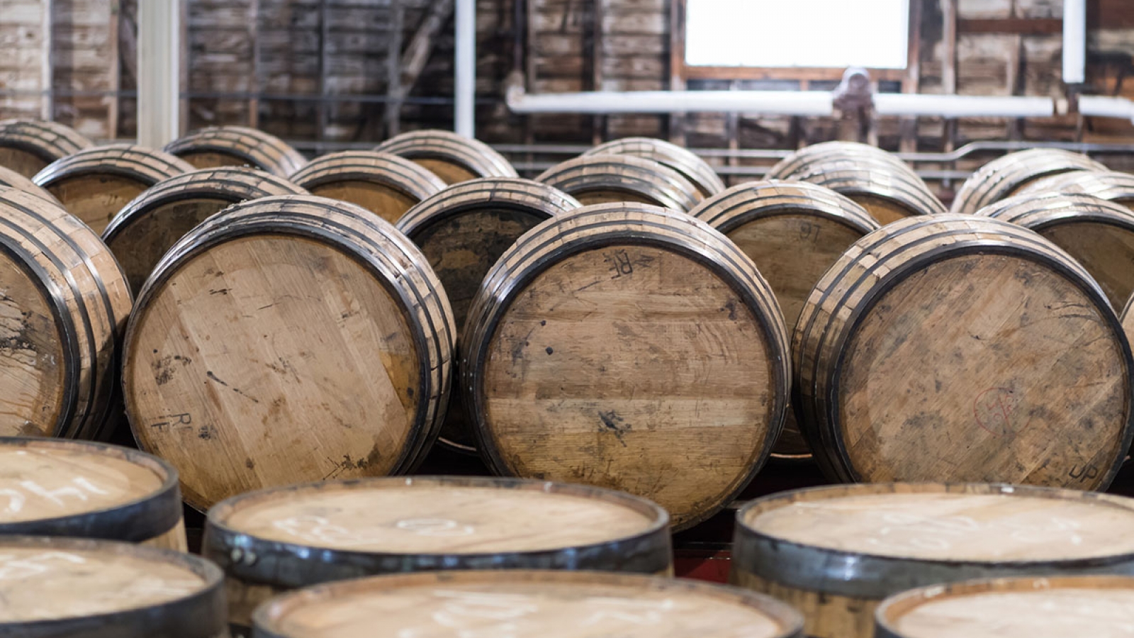 bourbon barrels inside a rickhouse