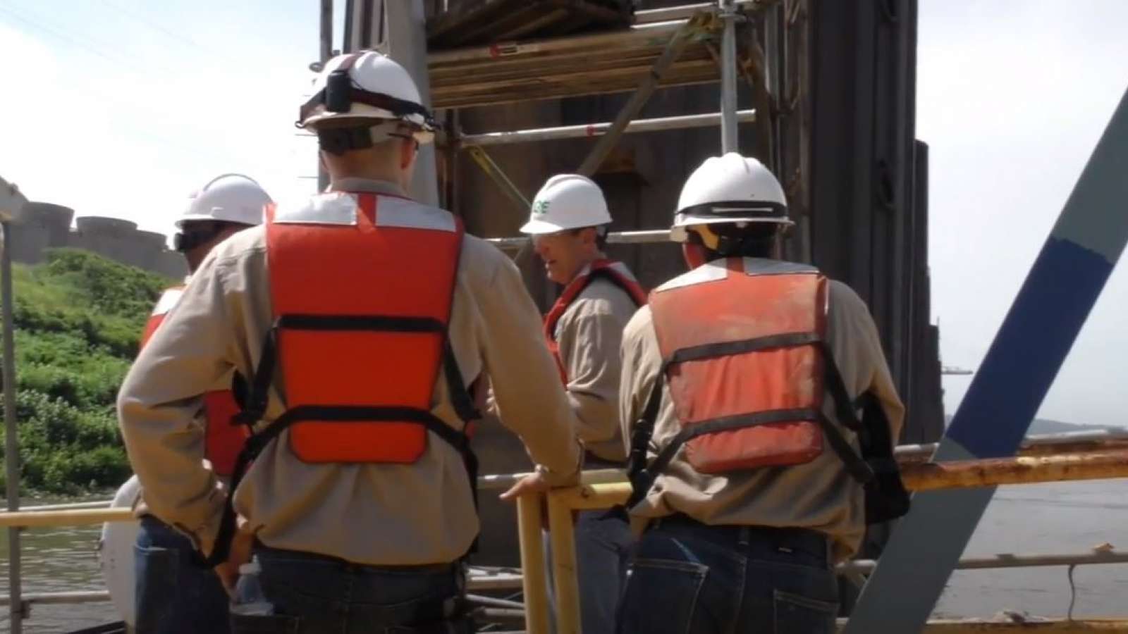 Co-op students wearing safety equipment at a power plant
