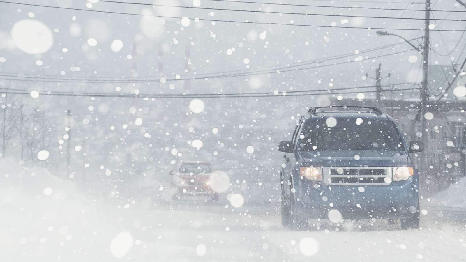 vehicle driving in snowstorm