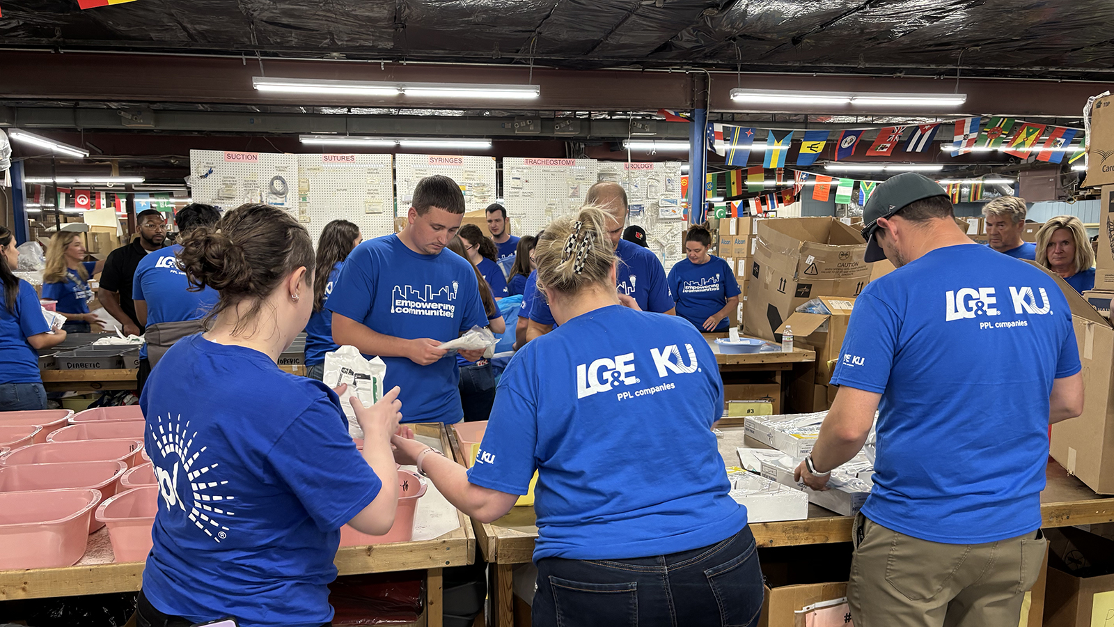 employee volunteers packing boxes