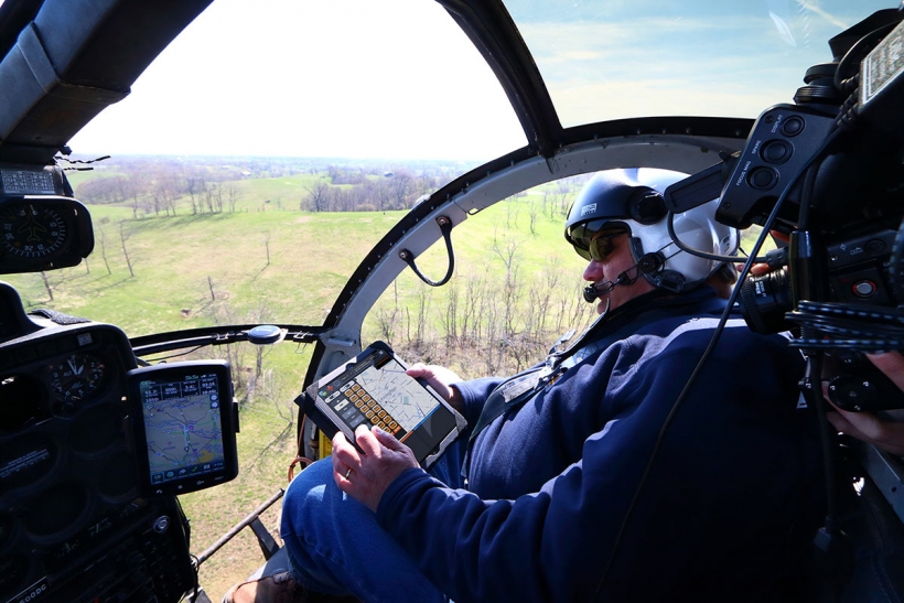 Air patrol helicopter surveying transmission lines