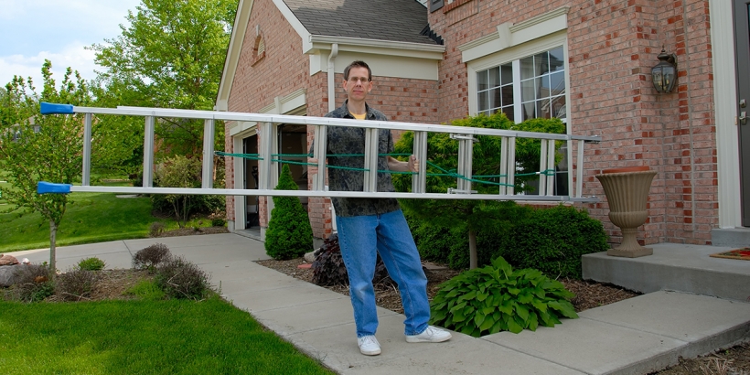 Carrying a ladder outside