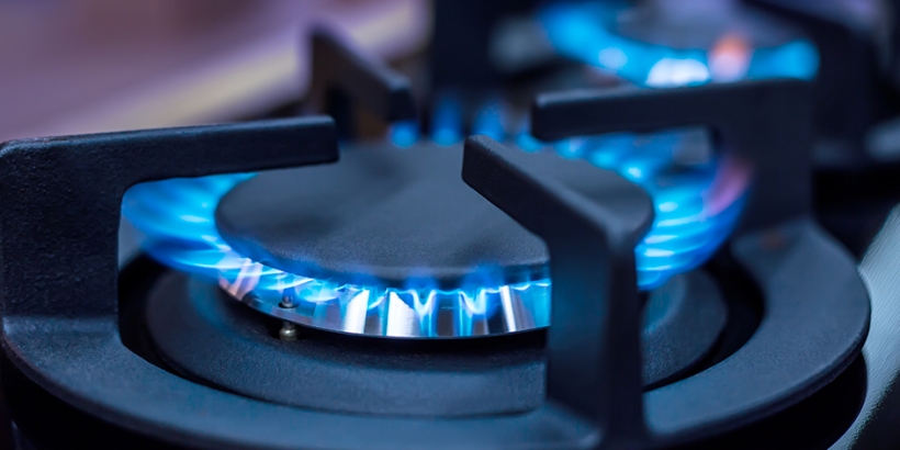 closeup of gas burners on a stove