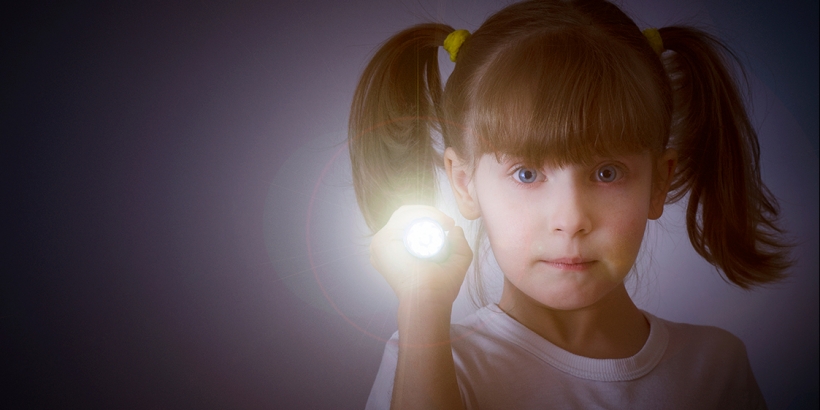 Little girl with flashlight
