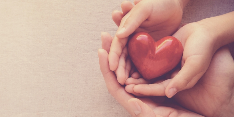 Hands holding heart