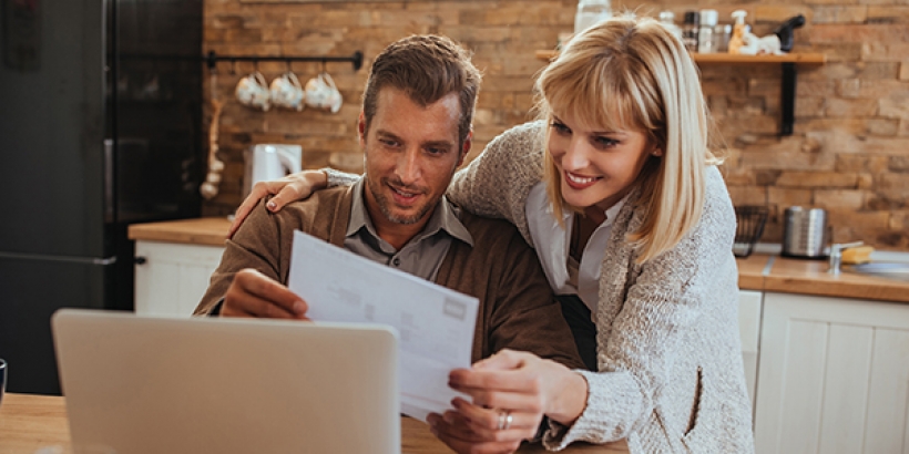 Couple looking at laptop