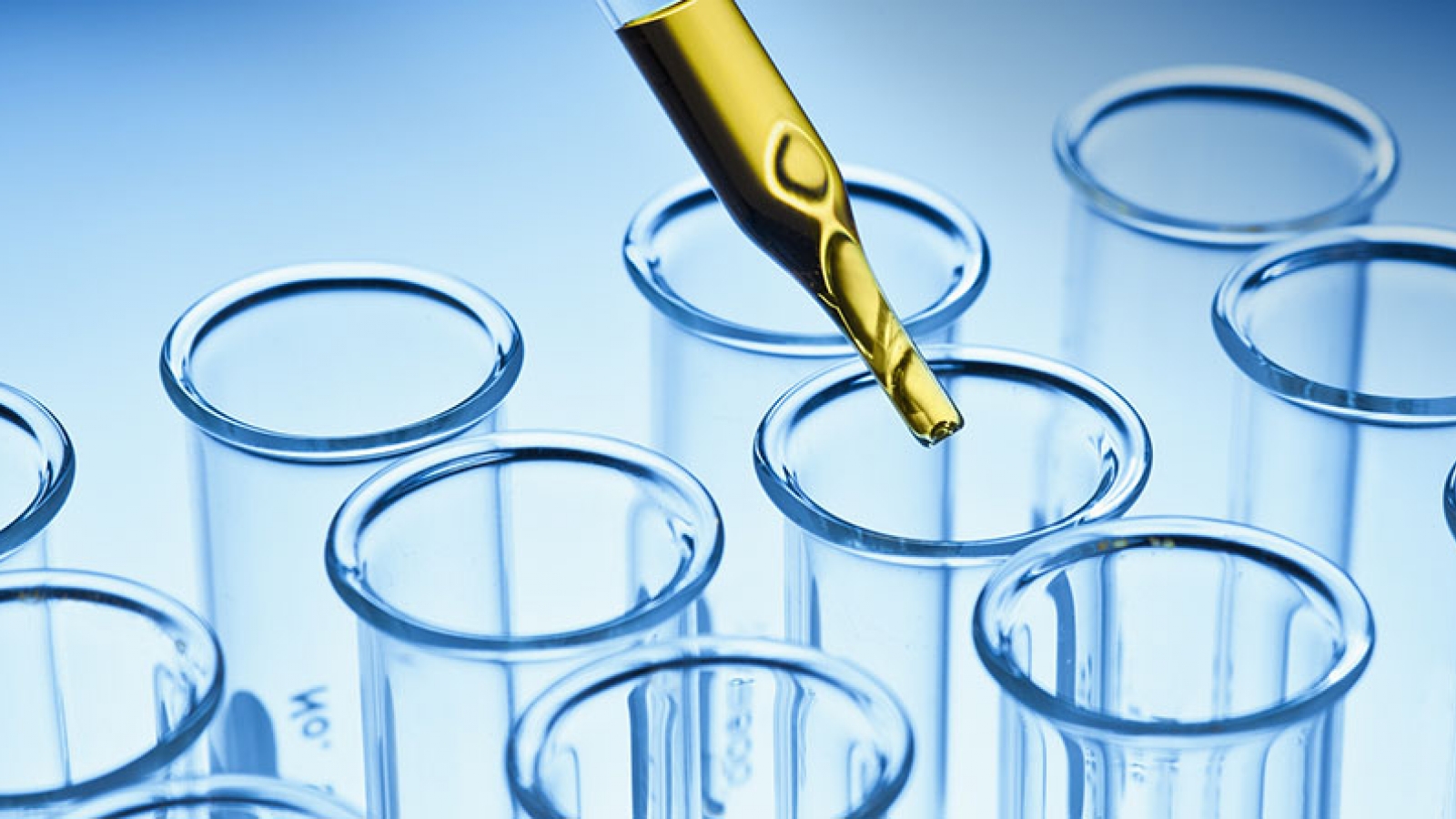 dropper above a grid of test tubes