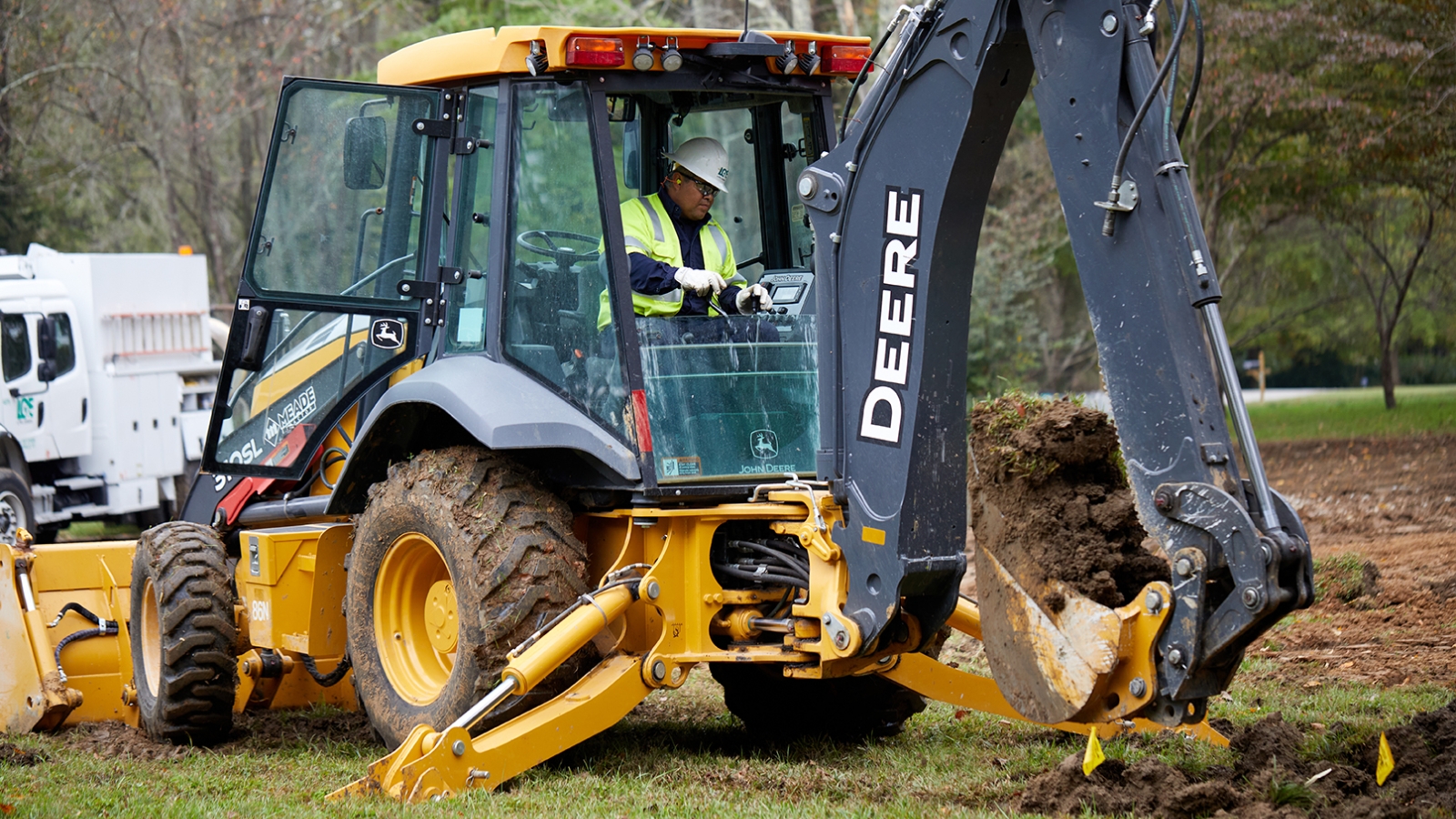 Excavator digging into the ground