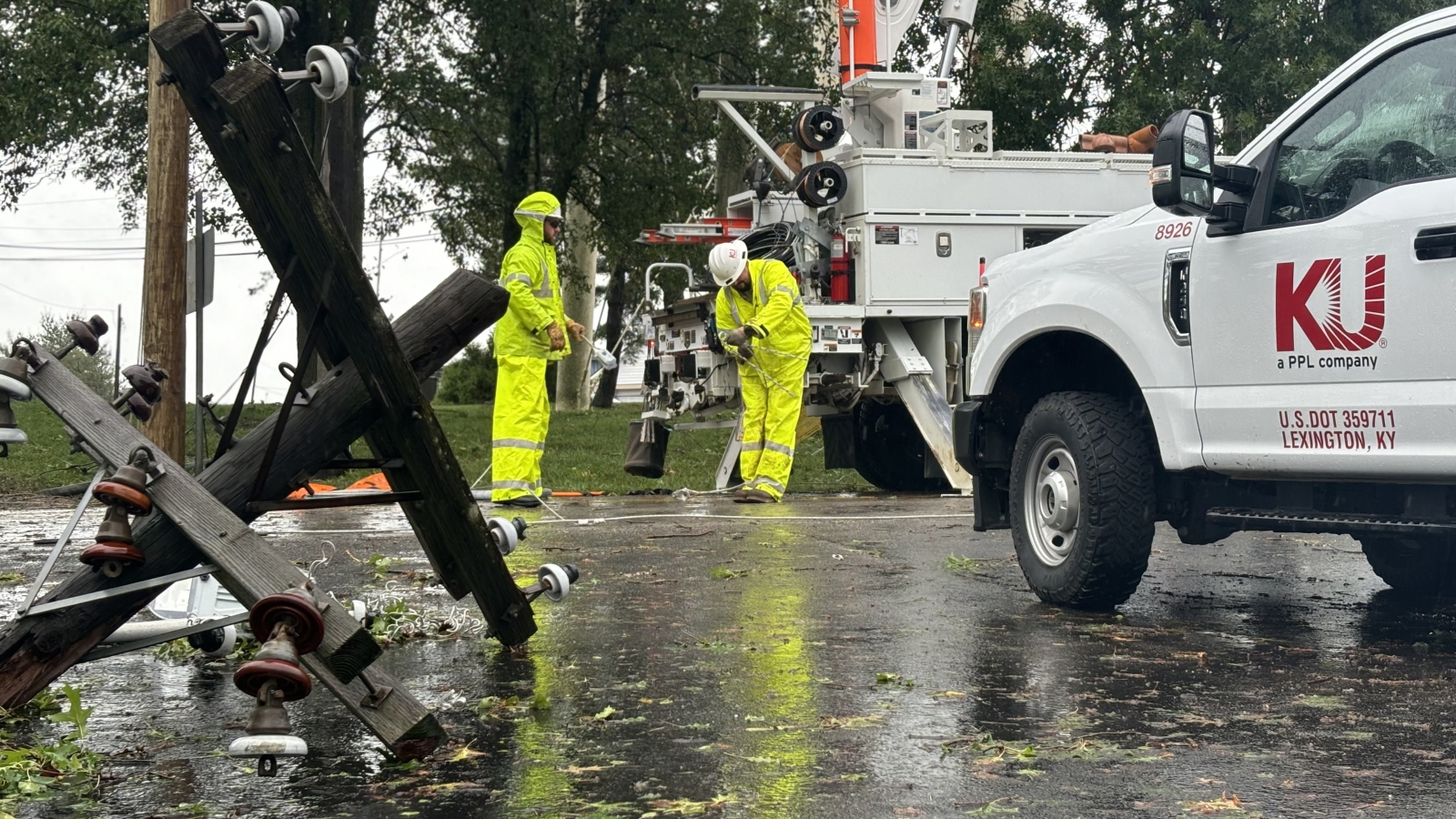 crew restoring power pole and lines