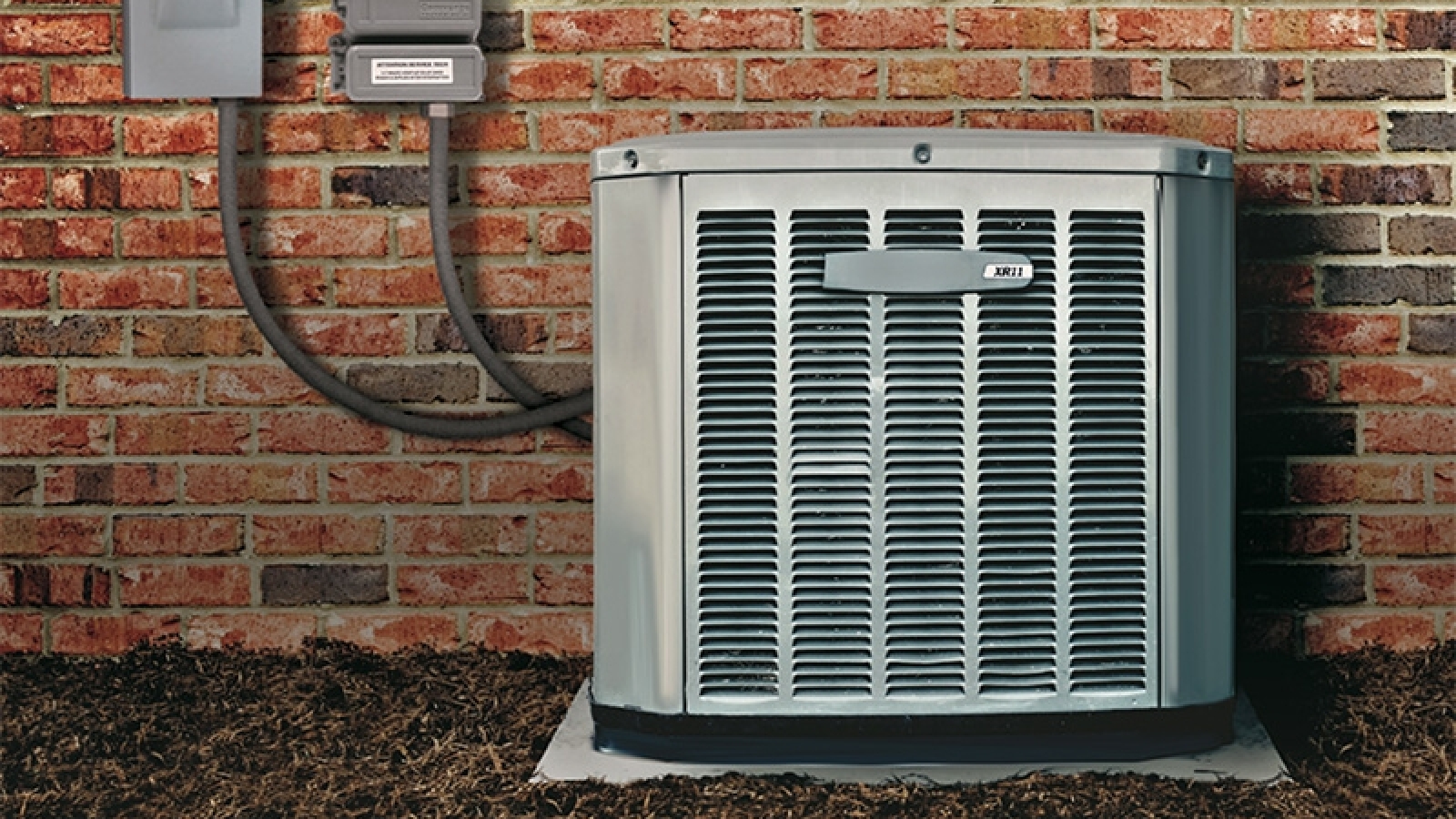 demand conservation device attached to HVAC unit outside of a house