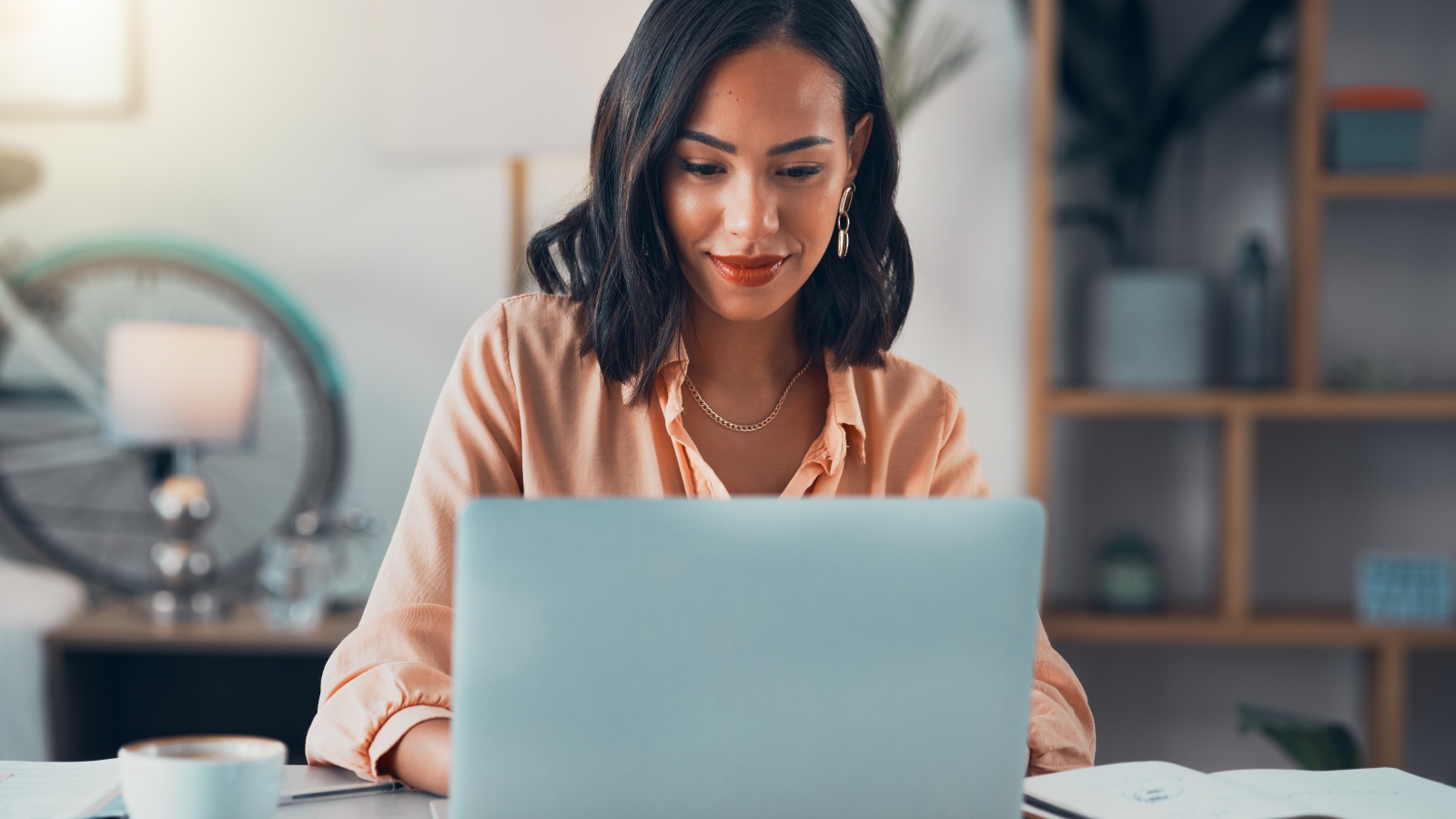 person at desk with laptop