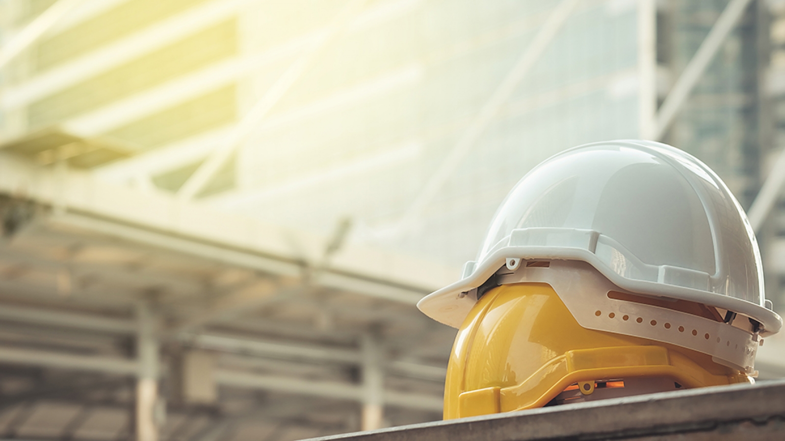 Two hardhats at a construction site