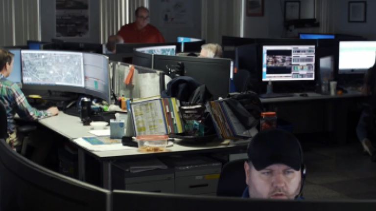 room with multiple call center employees receiving calls