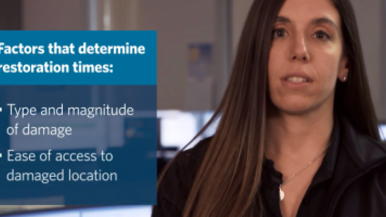 female employee in a room describing factors that determine restoration times