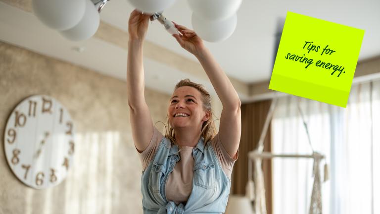 person changing light bulb