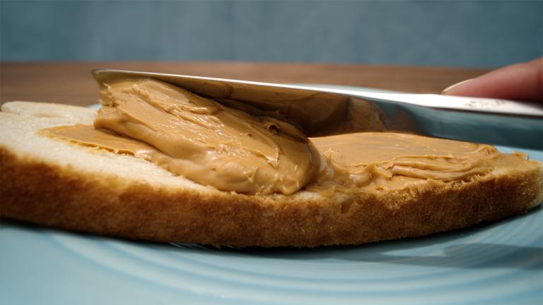 a plate of bread with peanut butter on it
