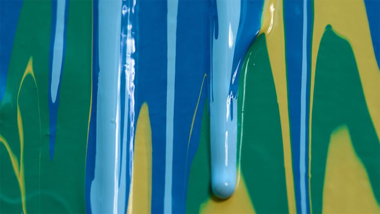 multi-color paint dripping down a canvas
