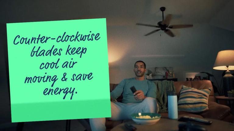Man under ceiling fan with words "Counter-clockwise blades keep cool air moving and save energy."