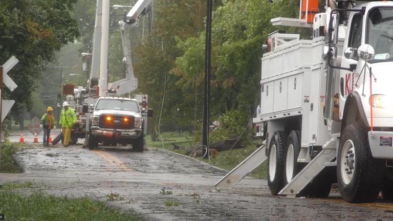 utility trucks working on power lines