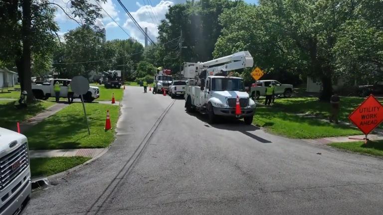 utility trucks on a neighborhood street