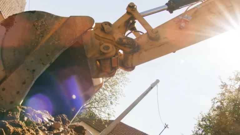 a backhoe in dirt