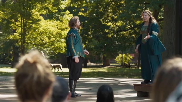 actors in a park in front of an audience