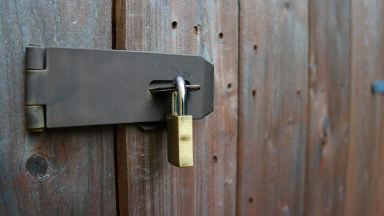 gate with a padlock securing it