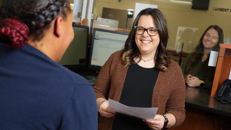 customer service employee smiling with customer