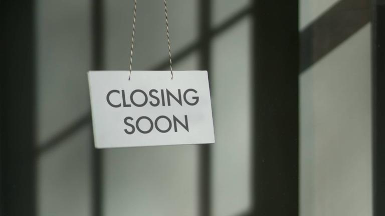 paper sign on door of an office