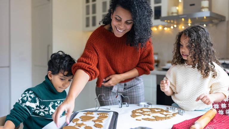 parent and kids baking cookies
