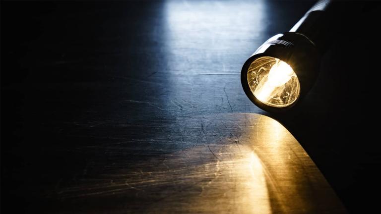 flashlight on a table