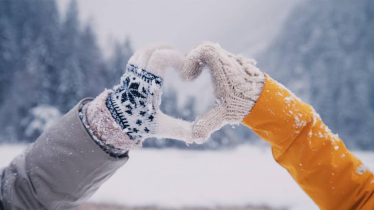 gloved hands forming a heart shape