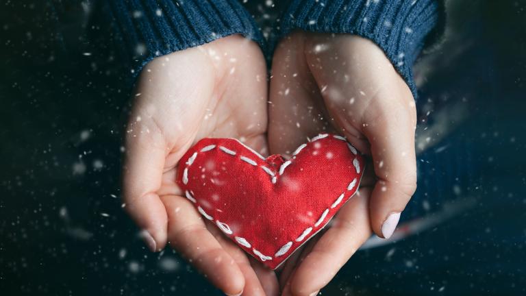 hands holding a craft heart