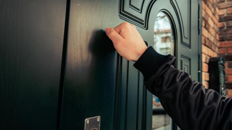 person knocking on a door