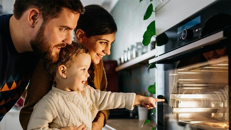 Family looking into oven