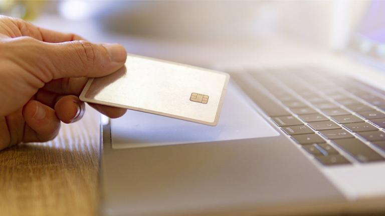 Person holding credit card