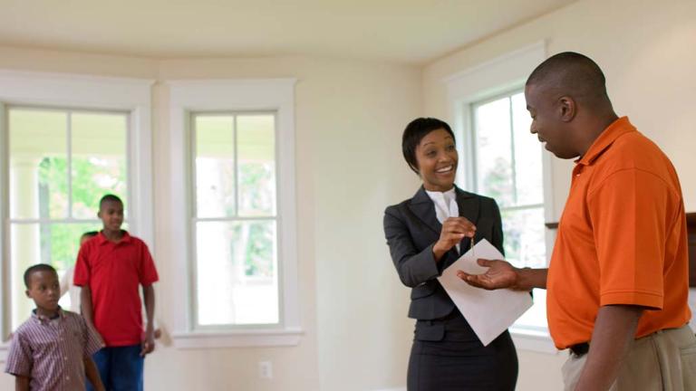Landlord handing keys to new tenant 