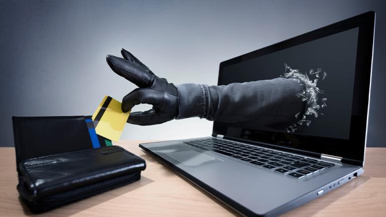 burglar arm reaches out from laptop screen to steal credit card