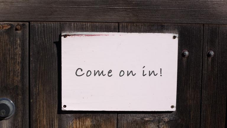 sign on door that reads come on in!