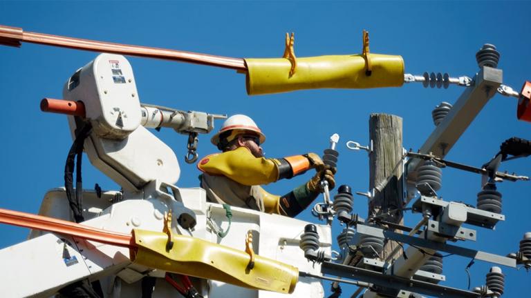 Lineman working on a utility pole