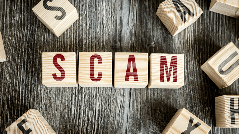 the word scam using wooden blocks