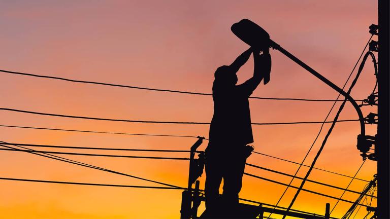 Employee working on streetlight