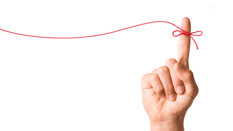 red string on a finger