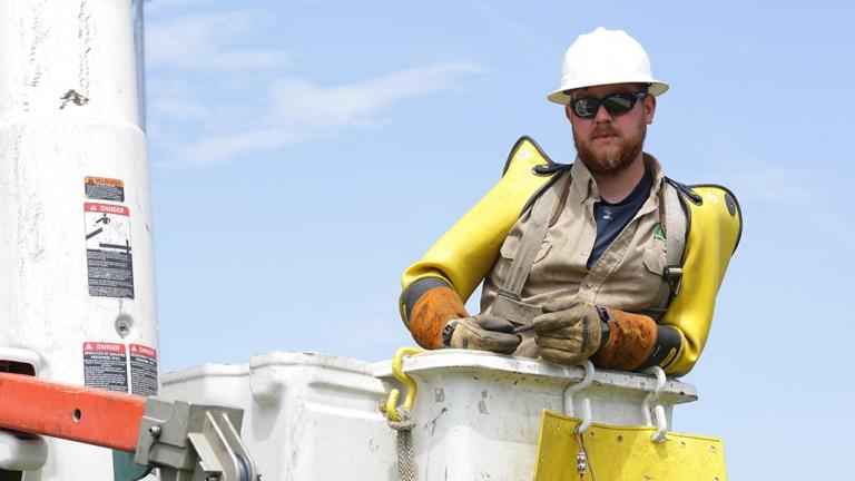 Employee in bucket truck