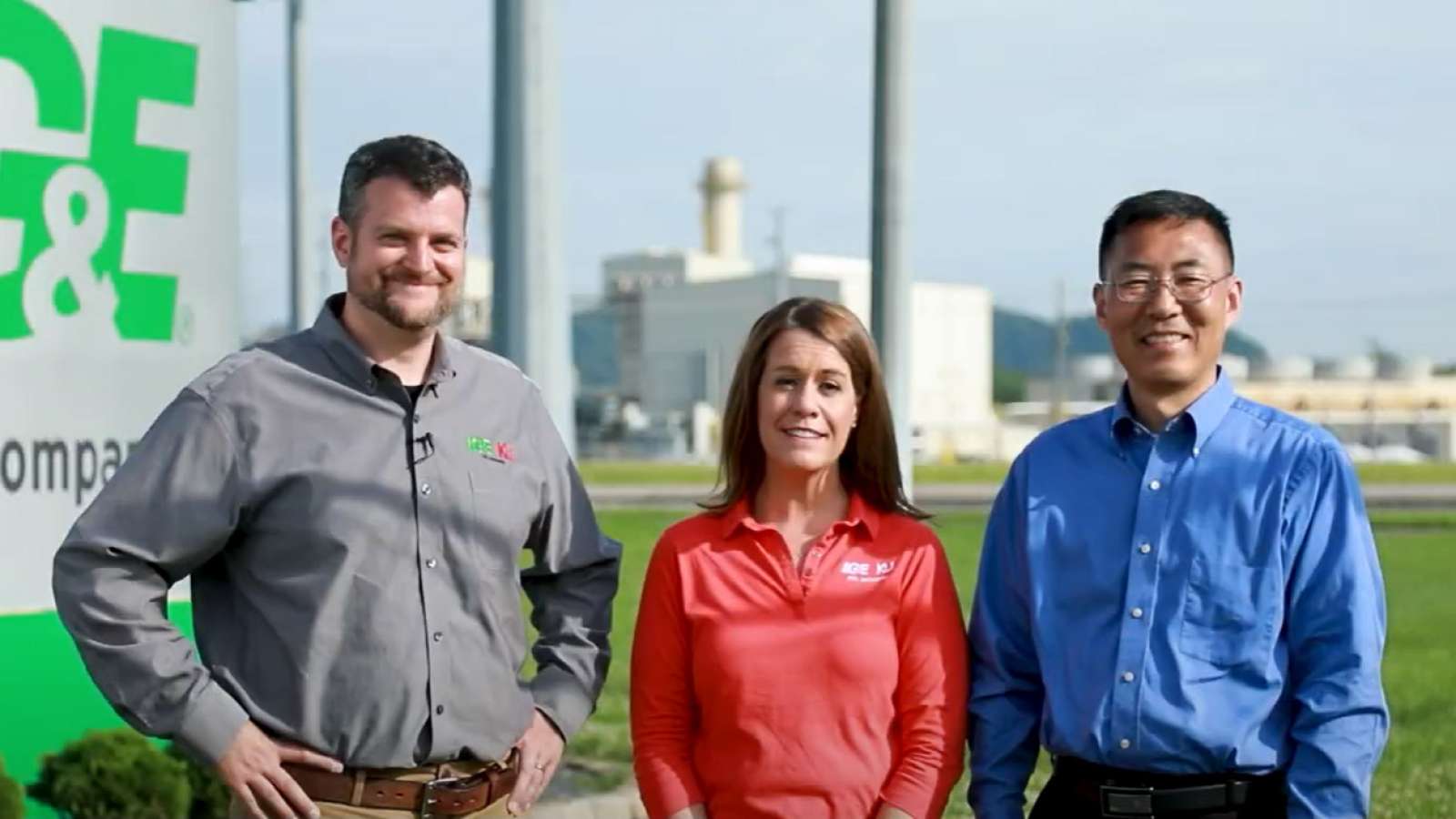 group photo of people in front of power plant