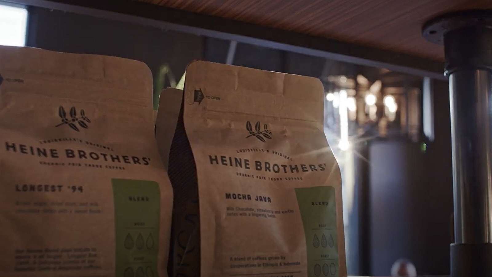 two bags of coffee on a shelf