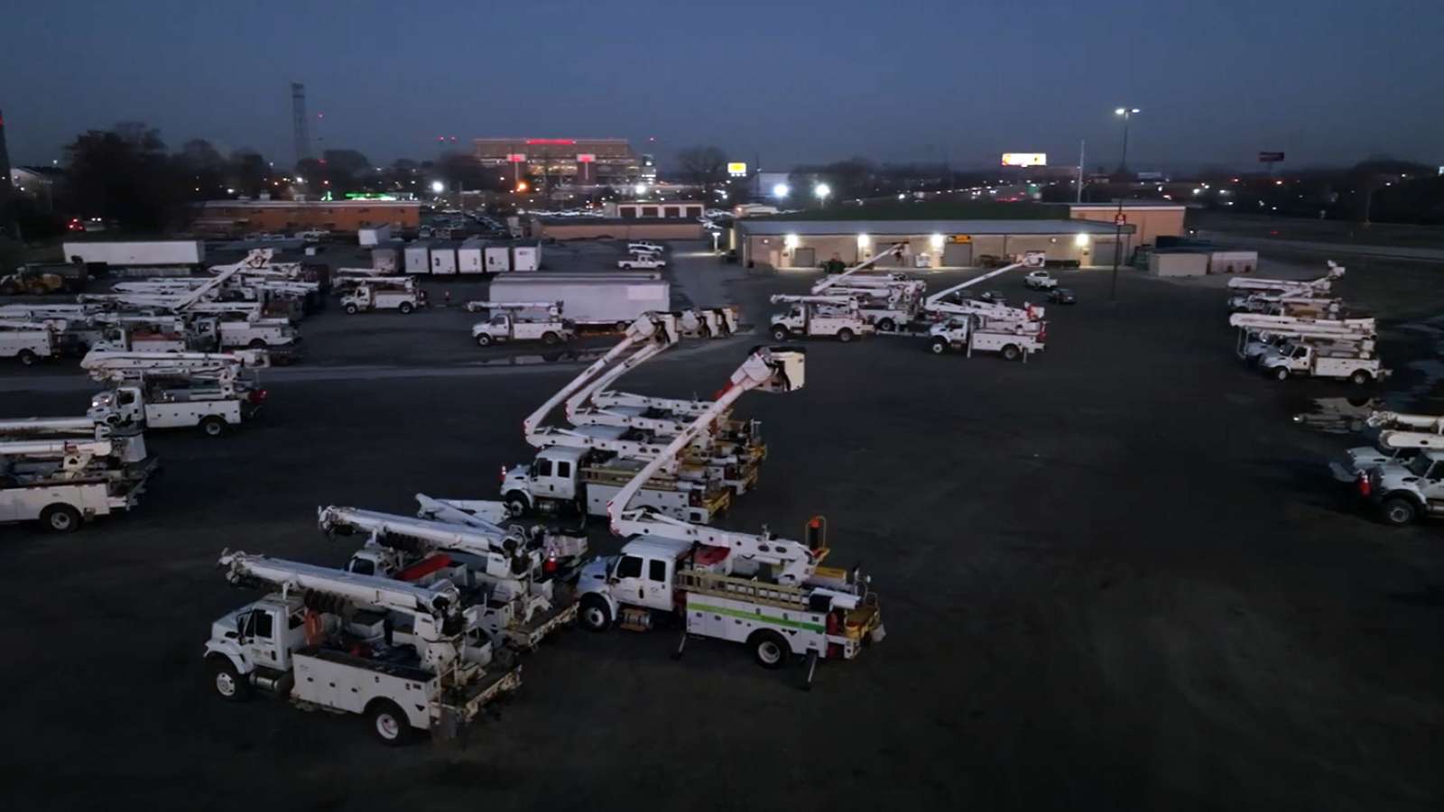 drone shot of bucket trucks staging at fairgrounds