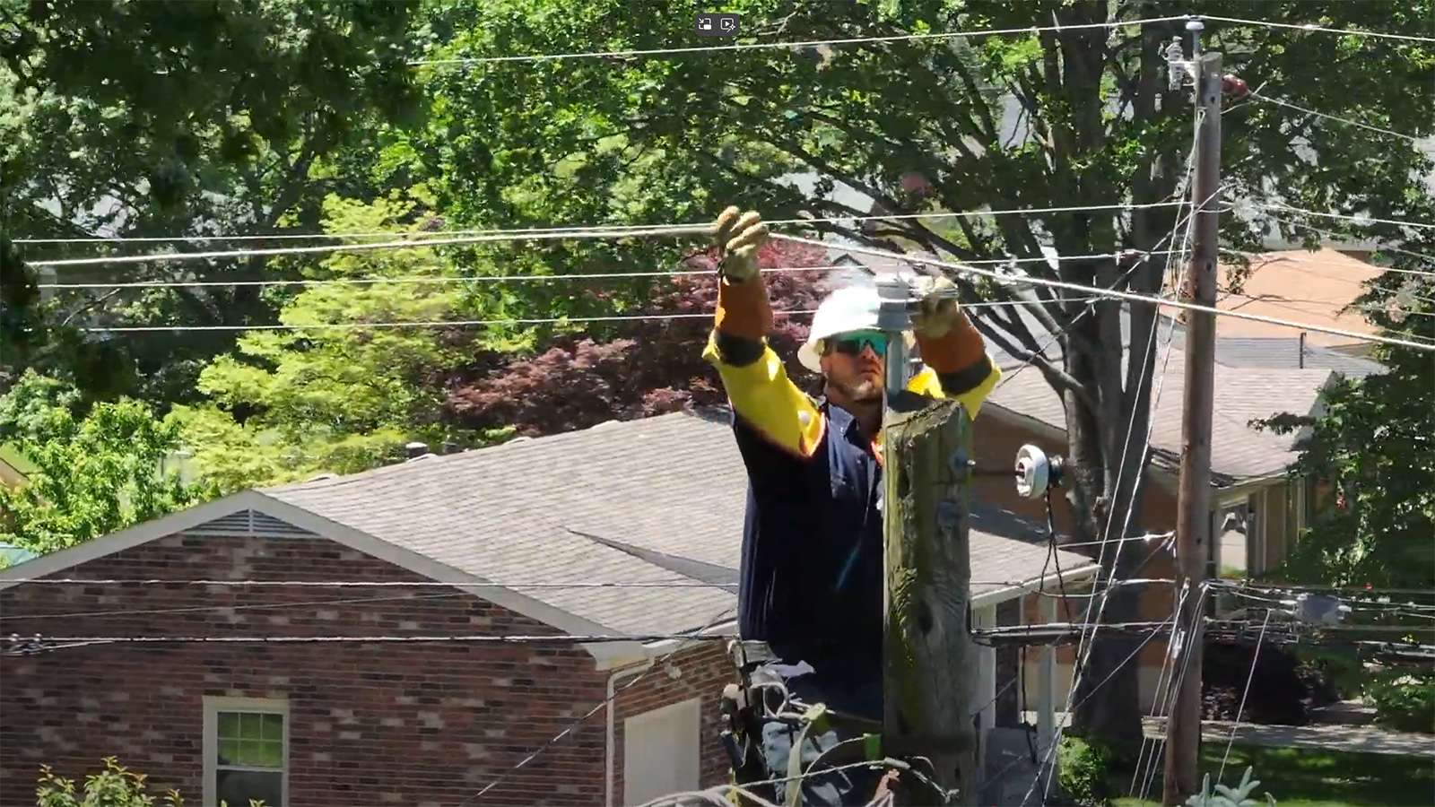 line technician working on a power line