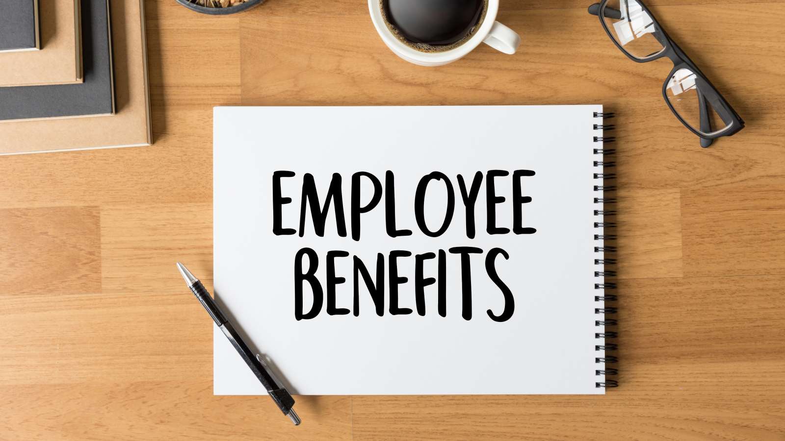 Pad of paper with the words "employee benefits".