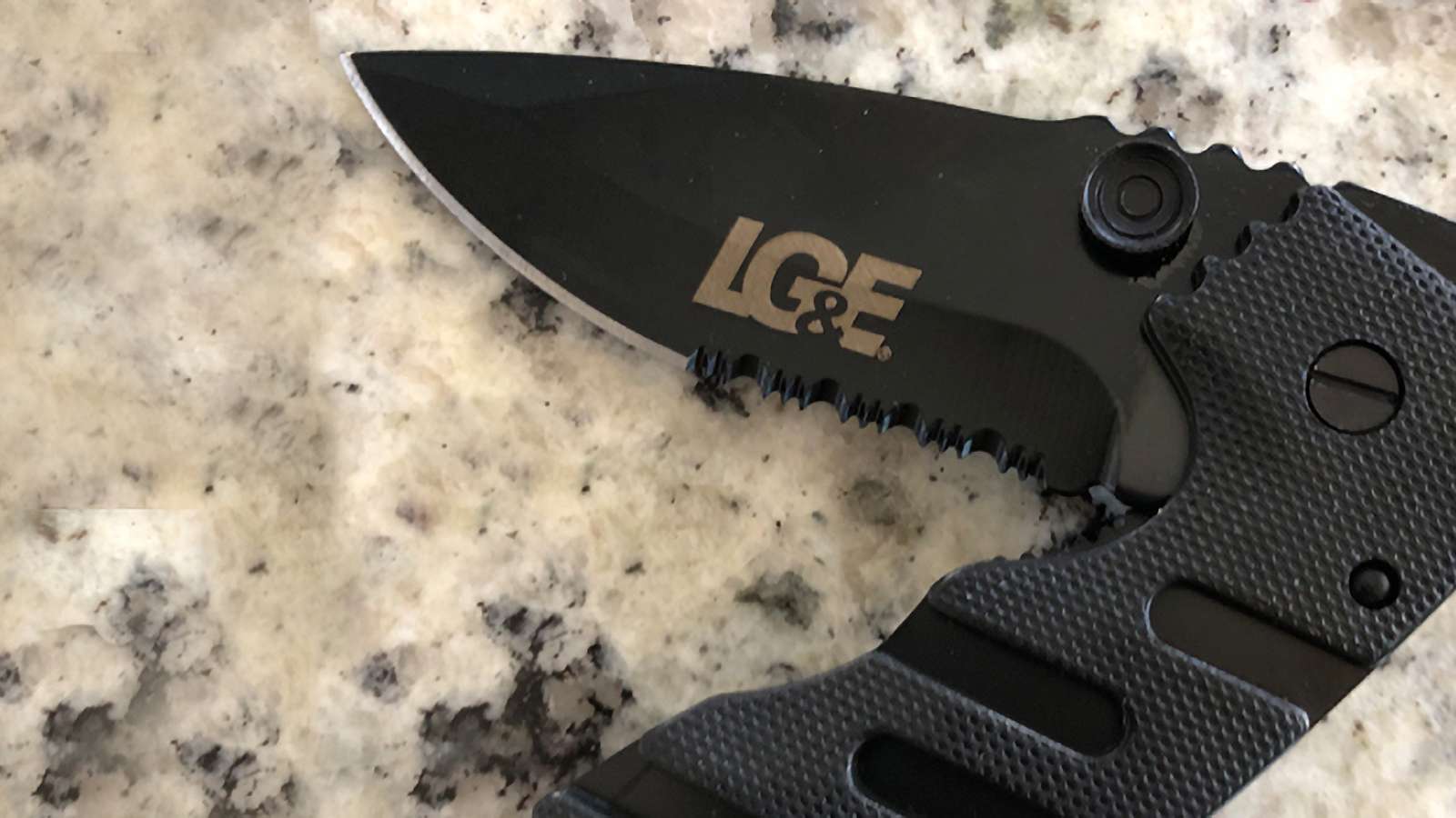 folding knife with LG&E logo on it